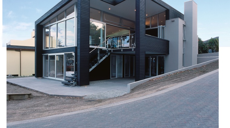 Exterior of home with dark stained weatherboard cladding. architecture, building, commercial building, elevation, facade, home, house, property, real estate, gray