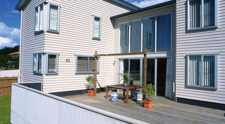 Exterior of two storey home with cream weatherboard cottage, elevation, facade, home, house, property, real estate, residential area, siding, window, gray