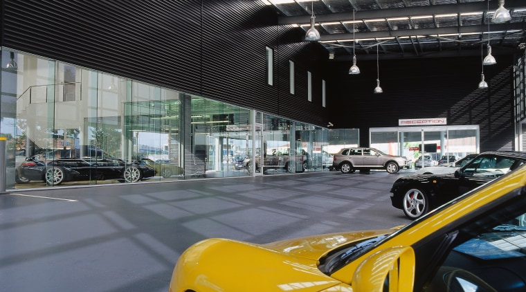 view of the canopy looking into the showroom, auto show, automotive design, automotive exterior, car, land vehicle, luxury vehicle, motor vehicle, performance car, sports car, supercar, vehicle, yellow, black, gray