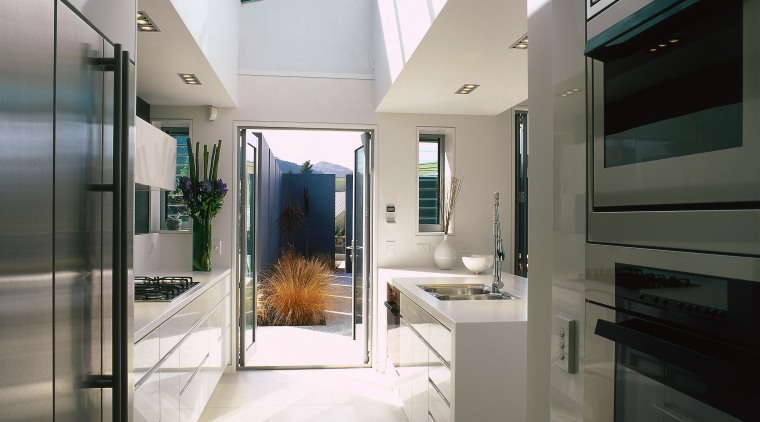 A view of the kitchen area, concrete tiled interior design, gray, black