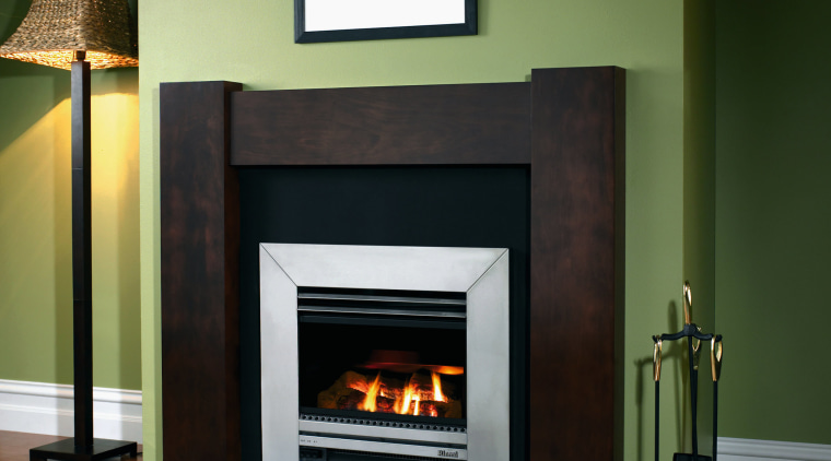 A view of an inbuilt fireplace with wooden fireplace, hearth, heat, home appliance, wood burning stove, black