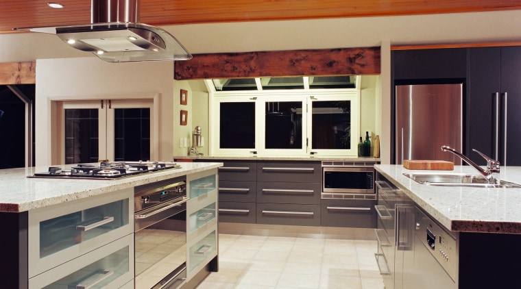 A viewof a kitchen area, cream tiled floor, cabinetry, ceiling, countertop, cuisine classique, floor, flooring, hardwood, interior design, kitchen, room, wood flooring, gray