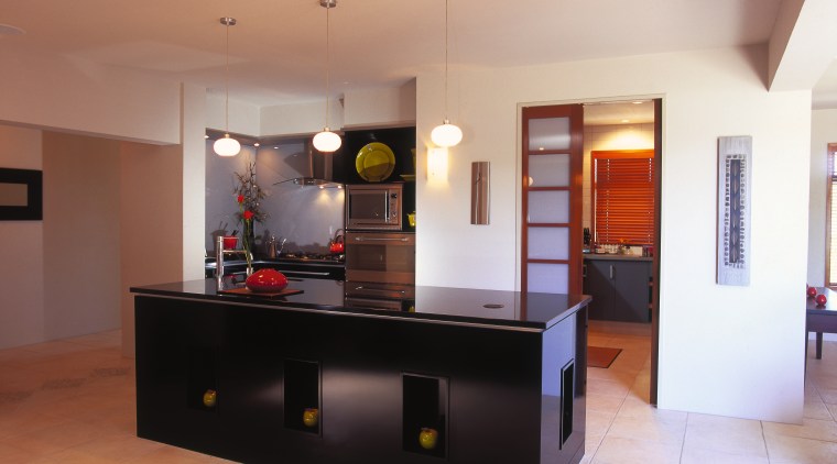 view of the island in the kitchen with furniture, interior design, kitchen, real estate, room, table, gray