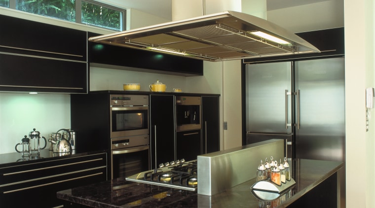 A view of a kitchen area, black granite ceiling, countertop, interior design, kitchen, under cabinet lighting, black