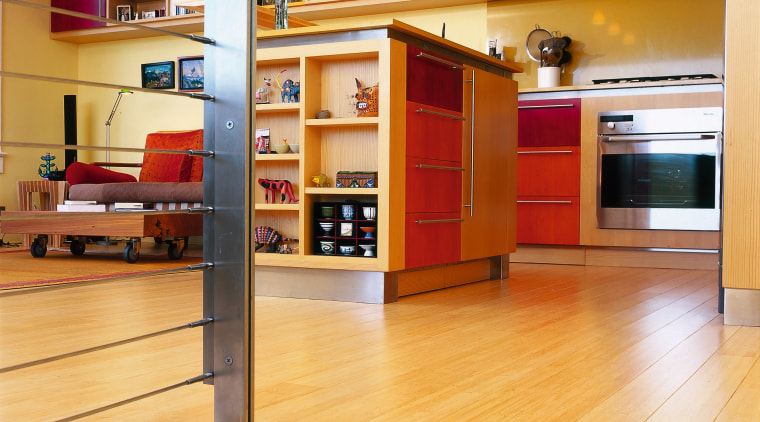 A view of the kitchen area from the bookcase, cabinetry, floor, flooring, furniture, hardwood, interior design, kitchen, shelf, shelving, wood, wood flooring, orange, brown