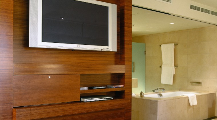 Hotel suite with built in timber veneer television cabinetry, floor, flooring, interior design, wood, brown