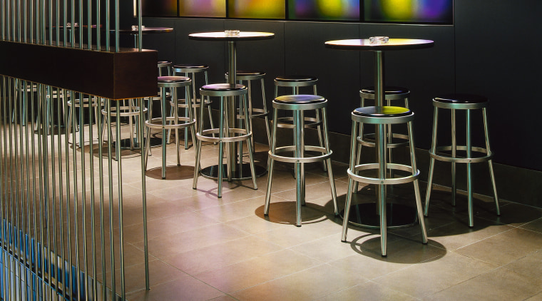 View of bar area with tiled flooring, bar floor, flooring, furniture, interior design, table, black, brown