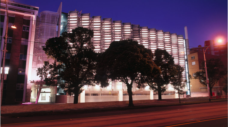 Exterior view of research centre building showing glass architecture, building, city, cityscape, daytime, downtown, dusk, evening, facade, infrastructure, landmark, light, lighting, metropolis, metropolitan area, night, reflection, sky, skyline, skyscraper, street light, tower block, tree, urban area, black, blue