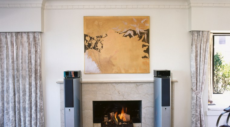 view of the bravo fx-10 speakers that are fireplace, floor, hearth, home, interior design, living room, wood burning stove, gray