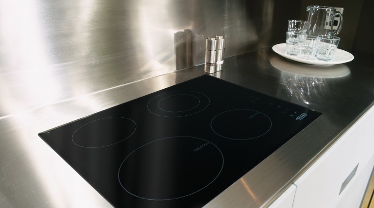 A view of a glass cooktop, stainless steel countertop, floor, kitchen, product design, sink, table, white, black