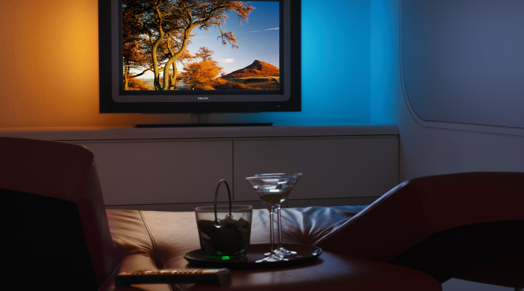 the phillips ambilight 2 technology provides ambient colour display device, entertainment, flat panel display, furniture, home, interior design, lighting, living room, multimedia, room, television, black