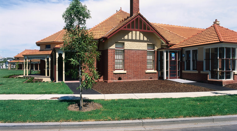 Historical brick building now part of the Commonwealth building, cottage, estate, facade, farmhouse, home, house, land lot, mansion, property, real estate, residential area, roof, sky, suburb