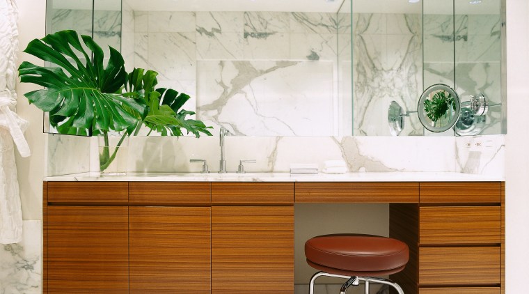 view of this bathroom featuring marble vein walls,floor furniture, interior design, product design, table, wall, white, brown