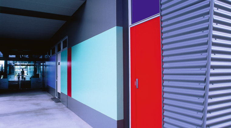 Bright red, blues and neutral colours were used architecture, blue, door, line, structure, blue