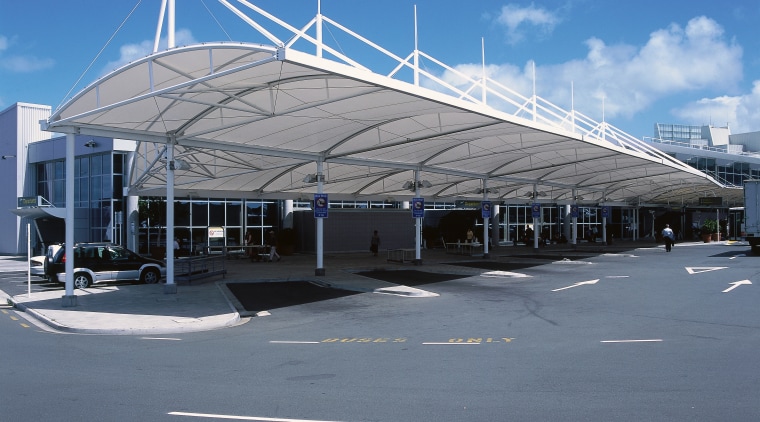 View of large sail-like canopy providing shelter outside airport, airport terminal, architecture, building, corporate headquarters, daylighting, infrastructure, sky, structure, gray, blue