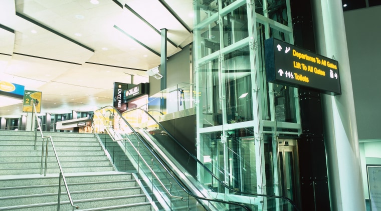 View of stairway, escalator and glass enclosed elevator. airport terminal, escalator, leisure, leisure centre, sport venue, structure, green, teal