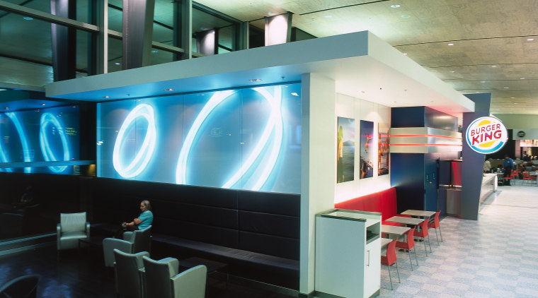 Burger King store with seating and lighting display. interior design, lobby, black