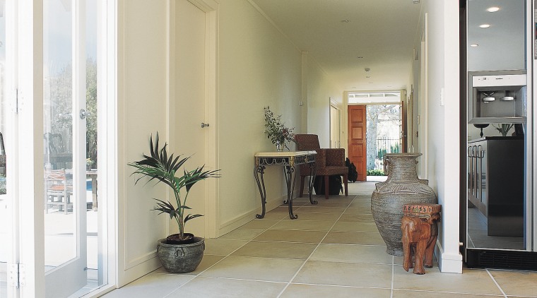 Interior hallway with sandstone paver flooring. - Interior floor, flooring, home, interior design, laminate flooring, living room, property, real estate, room, tile, window, wood flooring, white