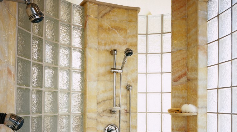 A view of the shower, glass tiled walls, bathroom, ceiling, floor, flooring, interior design, plumbing fixture, room, tile, wall, brown, gray