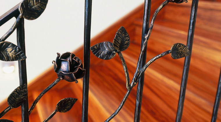 Timber staircase with ornate steel balustrading. - Timber iron, material, metal, wood, red, white