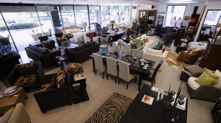 View of showroom with mix of furniture settings restaurant, black