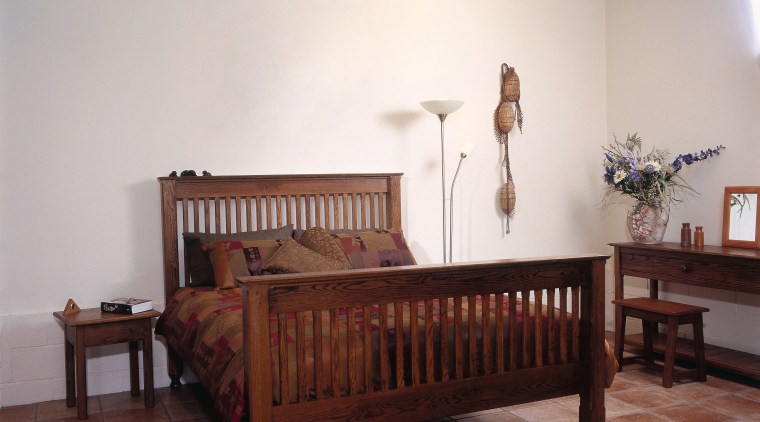 Bedroom with timber bed, side tables and dresser. bed, bed frame, bedroom, ceiling, floor, flooring, furniture, hardwood, home, interior design, mattress, product, real estate, room, wall, wood, wood flooring, white