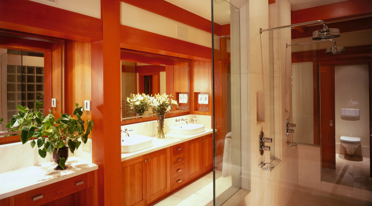 view of this bathroom featuring cherry wood vanity/cabinetry, cabinetry, ceiling, countertop, interior design, kitchen, real estate, room, red, orange, brown