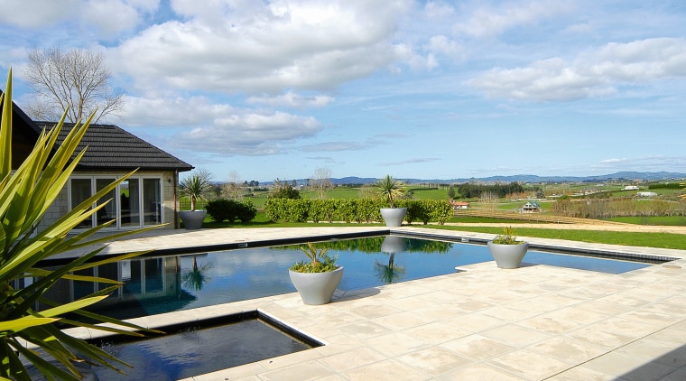 Outdoor pool with sandstone coloured pavers. - Outdoor cloud, estate, home, house, leisure, property, real estate, reflection, residential area, resort, sky, swimming pool, tree, villa, water, white