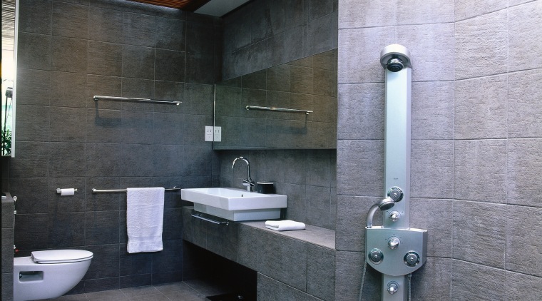 view of this bathroom that has a natural architecture, bathroom, interior design, public toilet, room, gray, black