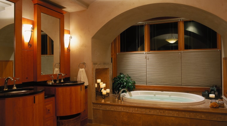 view of this bathrom featuring a noritz tankless architecture, bathroom, cabinetry, ceiling, estate, floor, flooring, home, interior design, lighting, real estate, room, brown