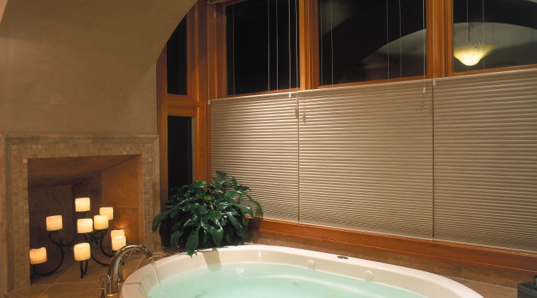 view of this bathrom featuring a noritz tankless architecture, bathroom, bathtub, estate, interior design, jacuzzi, property, room, brown