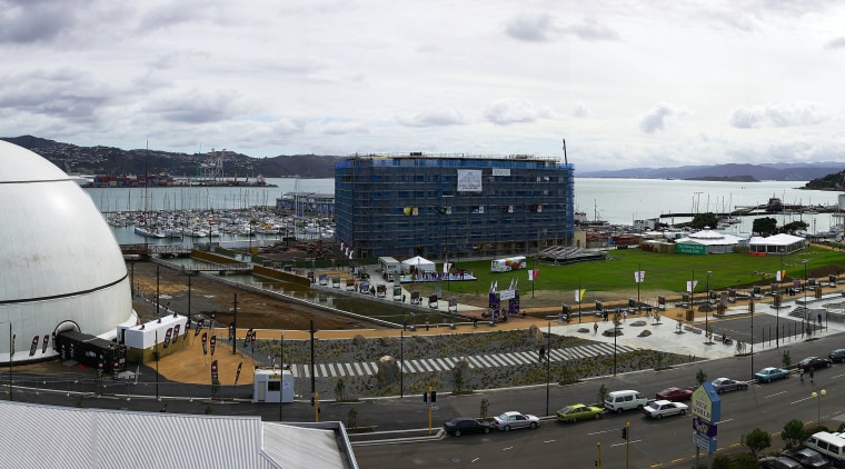 View of Wellington waterfront's Waitangi Park, with large city, white, black