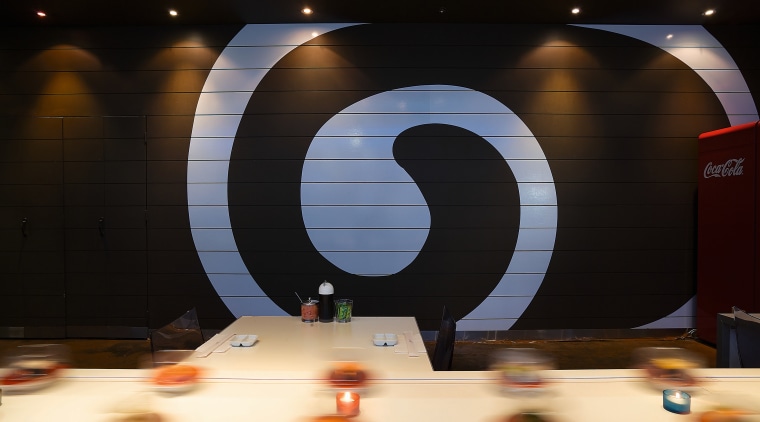 view of the interior of the sushi bar light, lighting, black