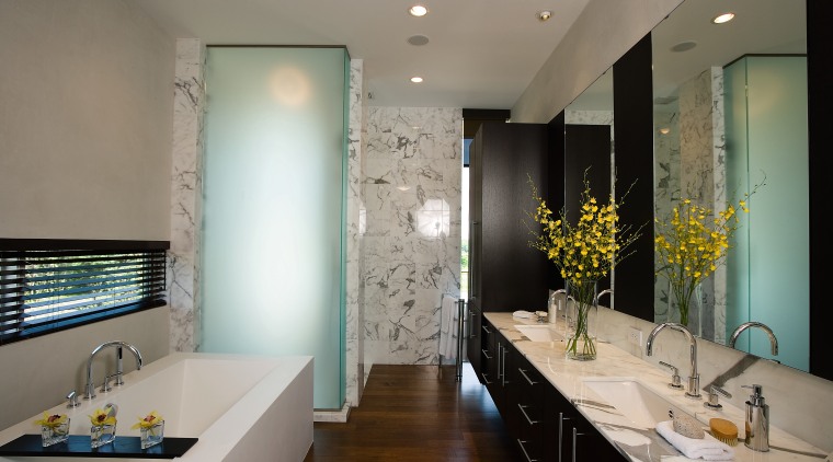 view of this bathroom featuring timber flooring, bathrub, architecture, bathroom, ceiling, countertop, home, interior design, real estate, room, gray