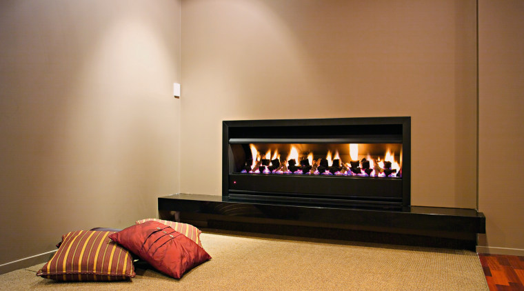 A view of a fireplace from Real Fires. fireplace, hearth, heat, interior design, wood burning stove, brown, orange