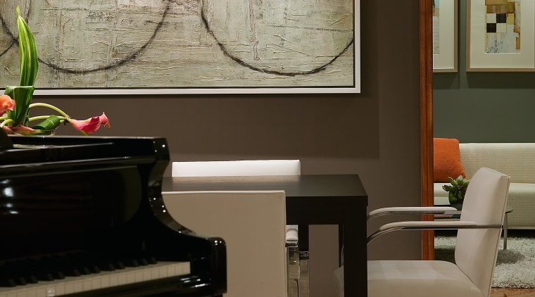 view of the living area featuring tiled flooring, floor, flooring, furniture, home, interior design, keyboard, living room, piano, table, technology, wall, wood, black, gray