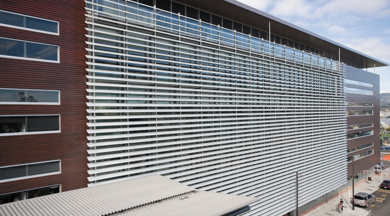 A view of the louvres. - A view architecture, building, commercial building, corporate headquarters, daylighting, facade, headquarters, house, line, metropolitan area, real estate, residential area, roof, siding, structure, window, window covering, gray, black, white