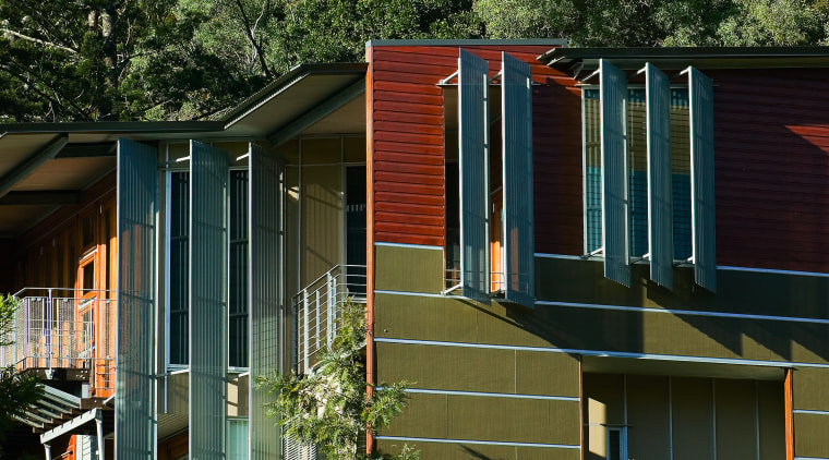 Exterior view of this new apartment block architecture, building, cottage, facade, home, house, neighbourhood, plant, real estate, residential area, siding, suburb, tree, black, brown