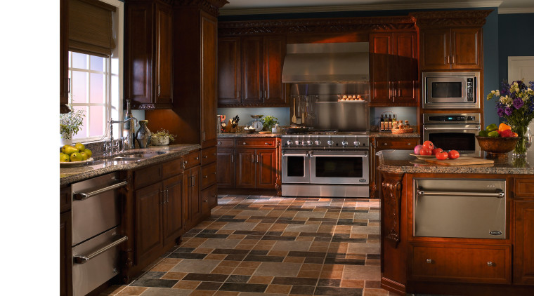 view of the kitchen featuring a DCS stainless cabinetry, countertop, cuisine classique, floor, flooring, hardwood, interior design, kitchen, room, wood flooring, brown