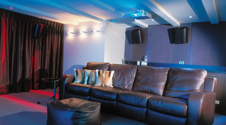 view of the theatre featuring brown leather furniture, blue, ceiling, home, interior design, lighting, room, blue