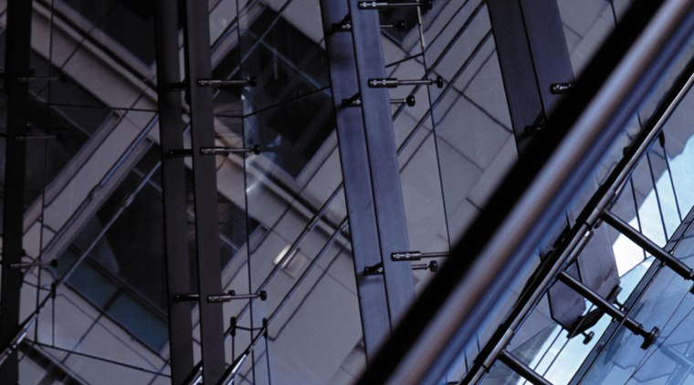 A close up view of the glass wall. angle, architecture, building, daylighting, daytime, facade, glass, line, metropolis, metropolitan area, reflection, sky, skyscraper, structure, symmetry, urban area, black