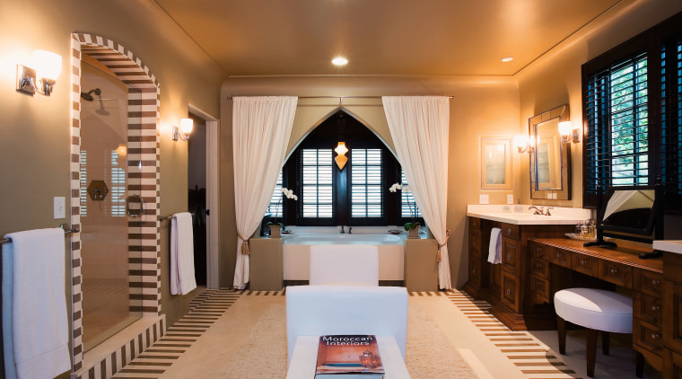 The spacious master bedroom includes a large double ceiling, interior design, room, brown