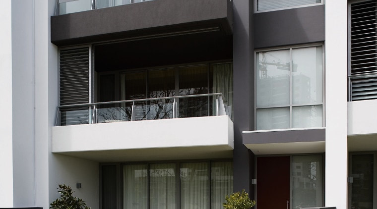 view of the apartment development featuring the high apartment, architecture, balcony, building, commercial building, condominium, elevation, facade, home, house, mixed use, real estate, residential area, window, black, gray
