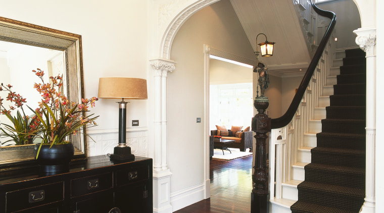 A view of the staircase, wooden flooring, carpeted architecture, ceiling, estate, floor, flooring, hardwood, home, house, interior design, living room, molding, property, real estate, room, stairs, wall, window, white, black