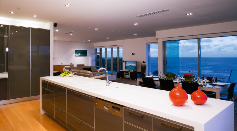 A viewof the kitchen and dining areas, wooden countertop, interior design, kitchen, real estate, room, white