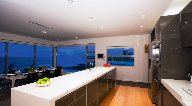 A view of a kitchen, wooden flooring, lights, countertop, interior design, kitchen, real estate, room, gray