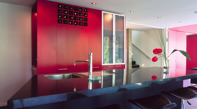 A view of the kitchen featuring tiled flooring, architecture, ceiling, countertop, glass, interior design, table, gray