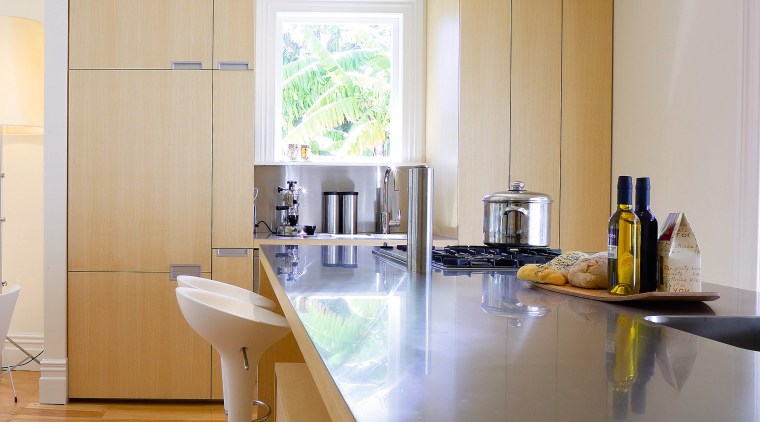 A view of the kitchen area, wooden flooring architecture, cabinetry, ceiling, countertop, daylighting, floor, flooring, home, house, interior design, kitchen, real estate, room, table, gray, brown, white