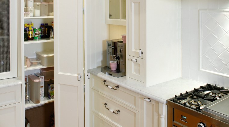 A view of a kitchen designed by Provincial cabinetry, countertop, cuisine classique, cupboard, floor, flooring, furniture, hardwood, home, home appliance, interior design, kitchen, room, shelf, shelving, wood flooring, gray, brown