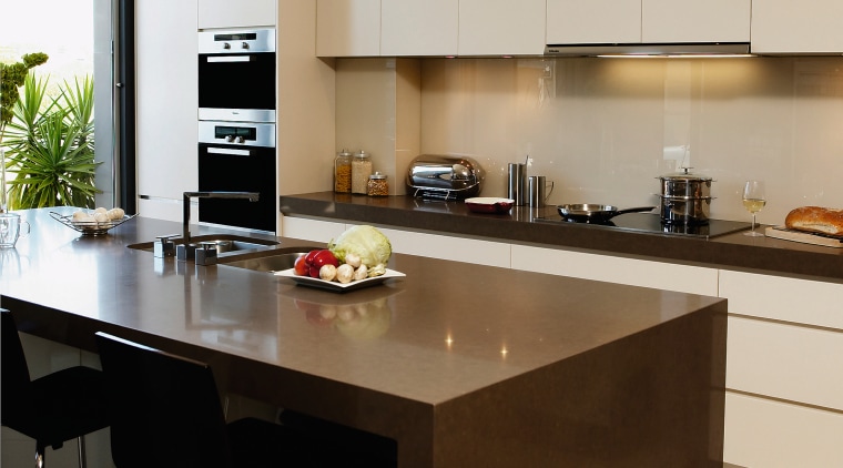 View of this modern kitchen designed by DK countertop, interior design, kitchen, brown, gray